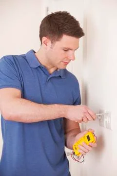 Electrician Testing Wiring On Light Switch Stock Photos