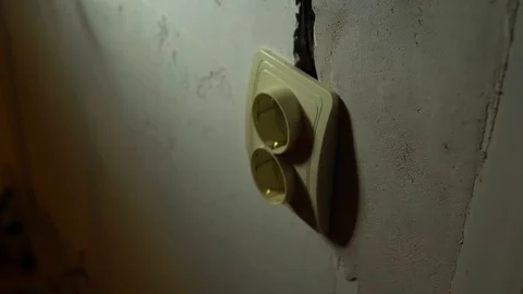 The electrician tests a socket with a special screwdriver. Stock Footage 84177869