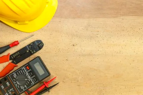 Electrician tools, components and instruments  on a wooden background Foto stock