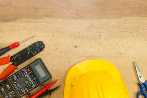 Electrician tools, components and instruments  on a wooden background Foto stock