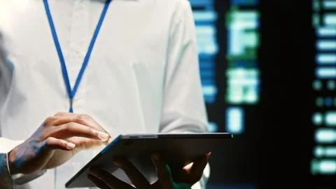 Electrician walks through supercomputers Stock Photos