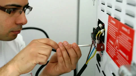 Electrician wiring appliance Stock Footage