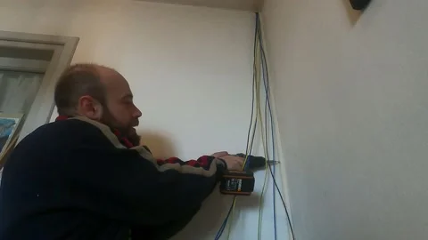 Electrician at work with drill Vídeo Stock 229408214