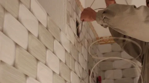 Electrician work installation of new wall Stock Footage 58200600