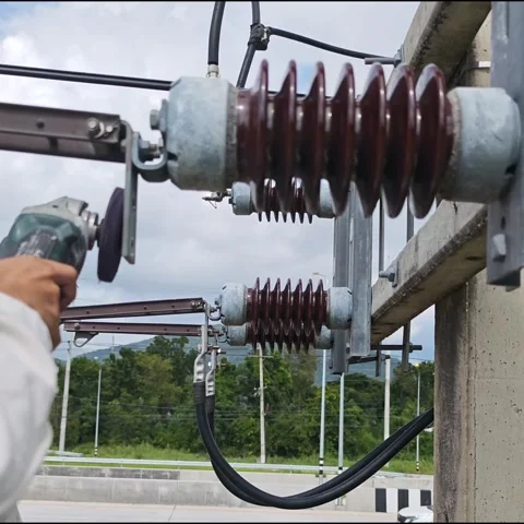 Electrician worker using angle grinder tool to polish and clean cable lug t.. Stock Footage 338017393