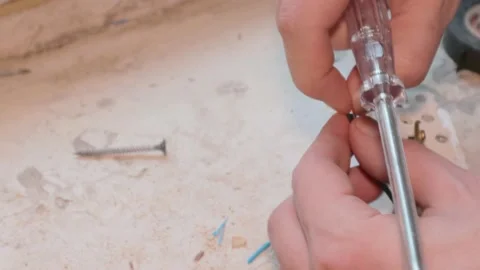 Electrician worker voltage work replacing the socket new cable 스톡 동영상 147250633