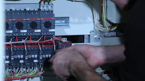 Electrician working on circuit board Stock Footage 76595010