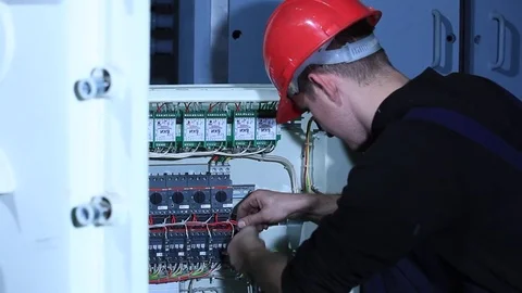 Electrician working on circuit board Stock Footage 76595034