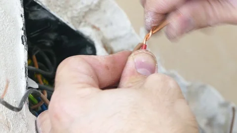 Electrician working on electrical installations - Closeup of hands and wires Stock-Footage 71478672