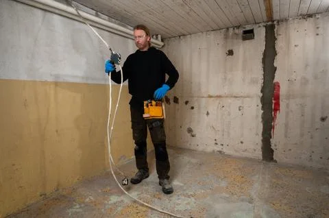 Electrician working with electrical junction box and cables Stock Photos