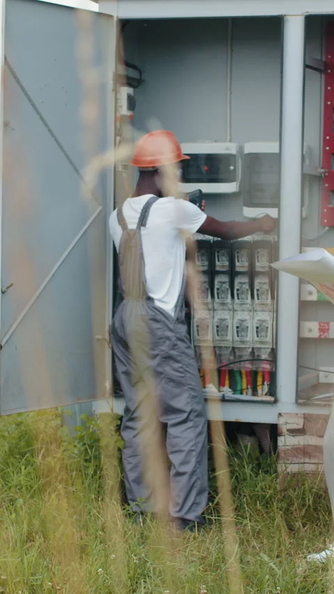 Electrician Working on Electrical Panel Stock Footage 318177713