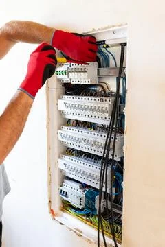 Electrician Working in Electrical Panel Stock Photos