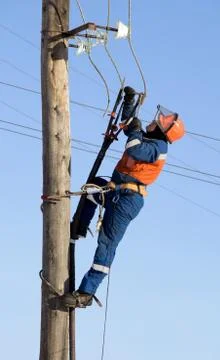 Electrician working at height Stock Photos