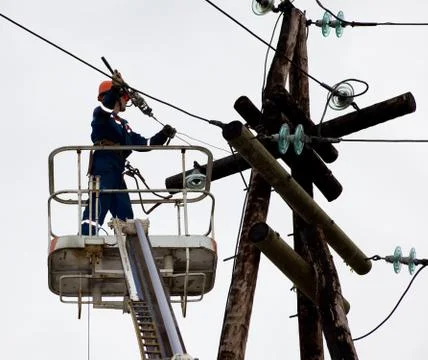 Electrician working at height Stock Photos