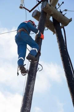 Electrician working at height Stock Photos