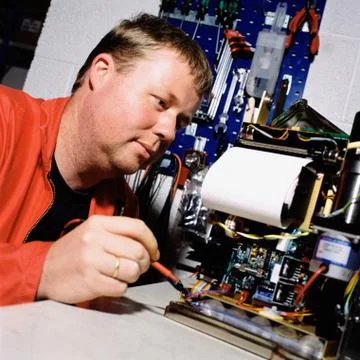 Electrician working on machine Foto stock