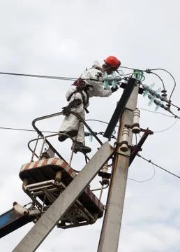 Electrician working at a pillar Stock Photos