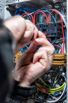 Electrician working on a residential electrical panel. Electricity. Stock-Fotos