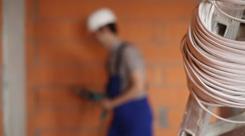 The electrician works with a drill Stock Footage 61696209