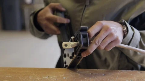 Electricians compresses the cable terminal to connect power Stock Footage 74228937