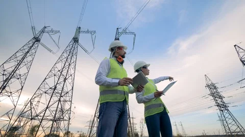 Electricians work with a tablet. Teamwork concept. Stock Footage 94864575