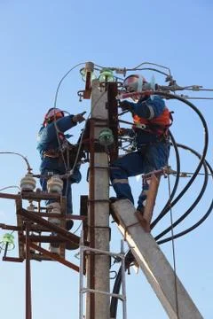 Electricians working at height Stock Photos