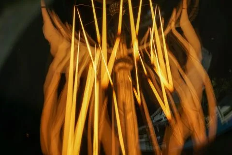 Electricity current inside a retro crystal clear light bulb. Stock Photos