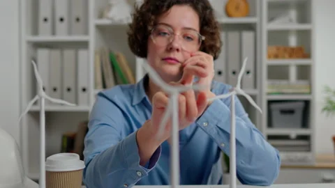 Electricity, Design Engineer Makes a phone call about wind energy. Wind turb Stock Footage 237691771