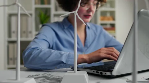 Electricity, Design Engineer Sitting at Planning Desk with Laptop Design Eng Stock Footage 237189208