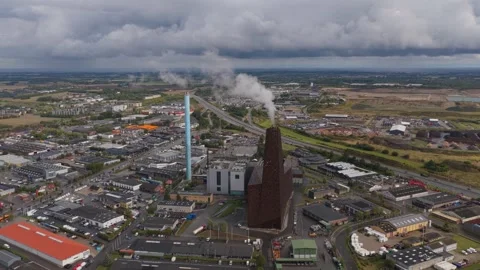 Electricity generation site with smoke stack, captured by drone. Stock Footage 318793377