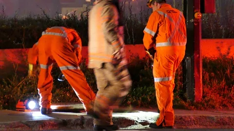 Electricity guy at structure fire Stock Footage 116014043