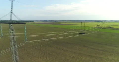 Electricity high voltage power lines and towers aerial view drone shot Stock Footage 145357591
