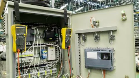 Electricity meter device meaure in control cabinet, Blur background of power  Stock Photos