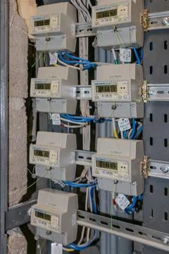 Electricity meters. Electrical panel. Electrical wires. Stock Photos