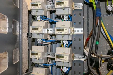 Electricity meters. Electrical panel. Electrical wires. Stock Photos
