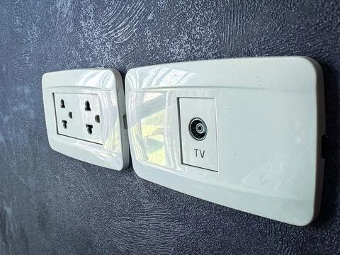 Electricity plug on the wall background 库存照片