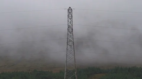 Electricity Pole and Fast Clouds with a Hill in the Backgrou Stock Footage 87197584