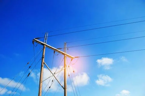 Electricity poles with blue sky. Stock Photos