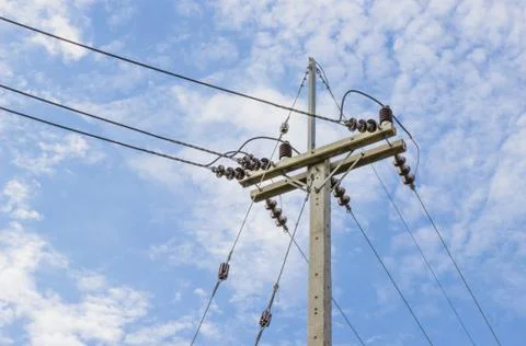 Electricity post in blue sky background Stock Photos