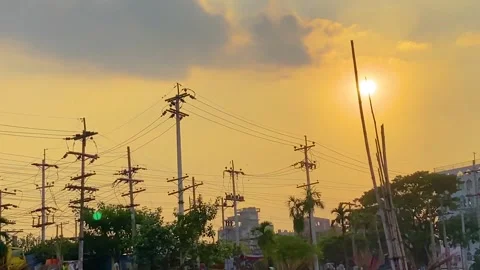 Electricity power grid third world country sun behind clouds grey skyline Stock Footage 310602646