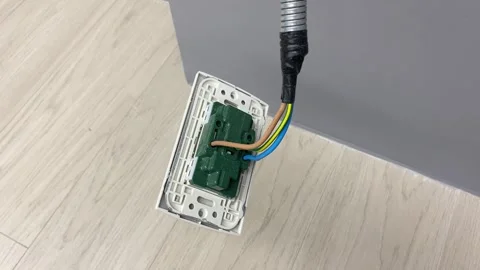 Electricity power line switch plug socket hanging from ceiling inside room Stock Footage 249590377