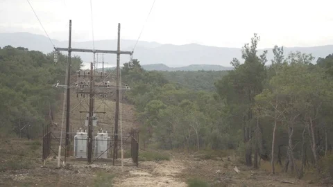 Electricity pylon cables seen from car tracking shot slow motion Stock Footage 100225700
