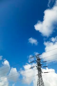 Electricity pylon &amp; cloudy sky Stock Photos