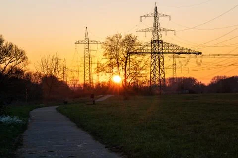 Electricity pylon at sunset Stock Photos
