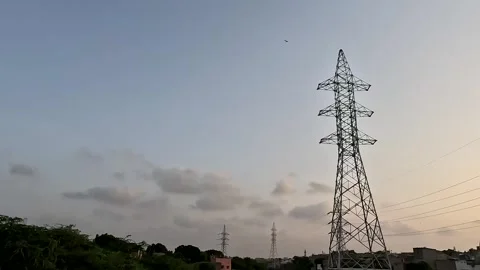 Electricity Pylon Tower At Sunset With Cloudy Sky Vidéo 344567198