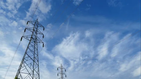 Electricity pylon,Electricity tower station with cloudy and sun over blue sky Stock Footage 64492829