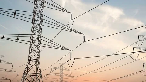 Electricity pylons. Moving along two row of pylons. electric high voltage pylon Vídeo Stock 75337355