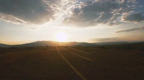 Electricity pylons at sunset Stock Footage 68186935