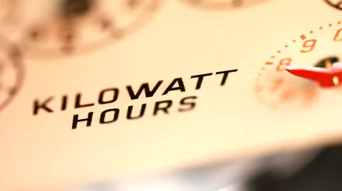 Electricity supply meter kilowatt hour dial close up Stock Footage