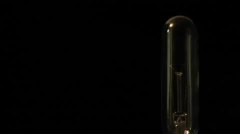 Electricity from a tesla coil based violet wand jumps to a probe shaped bulb Video stock 46941404